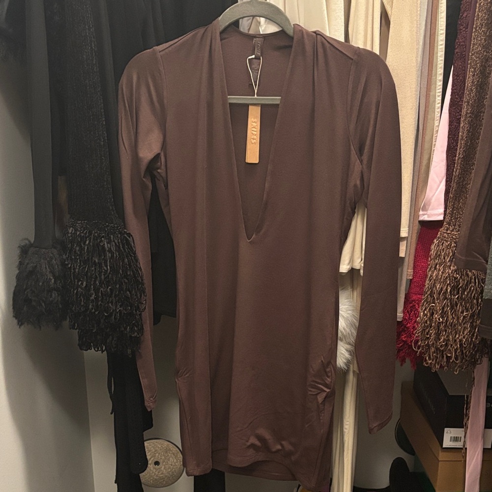 JUST SOLD on another platform. Skims deep plunge Dress